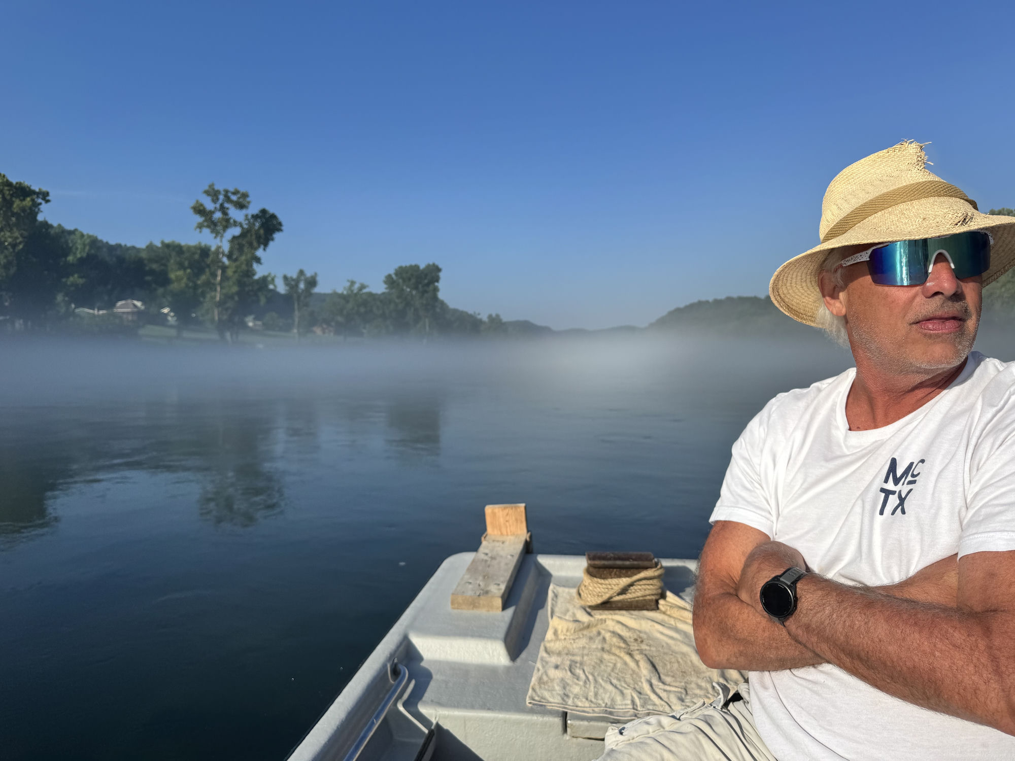 Early morning on the White River. Cold tailwater fog rising into a July sky.