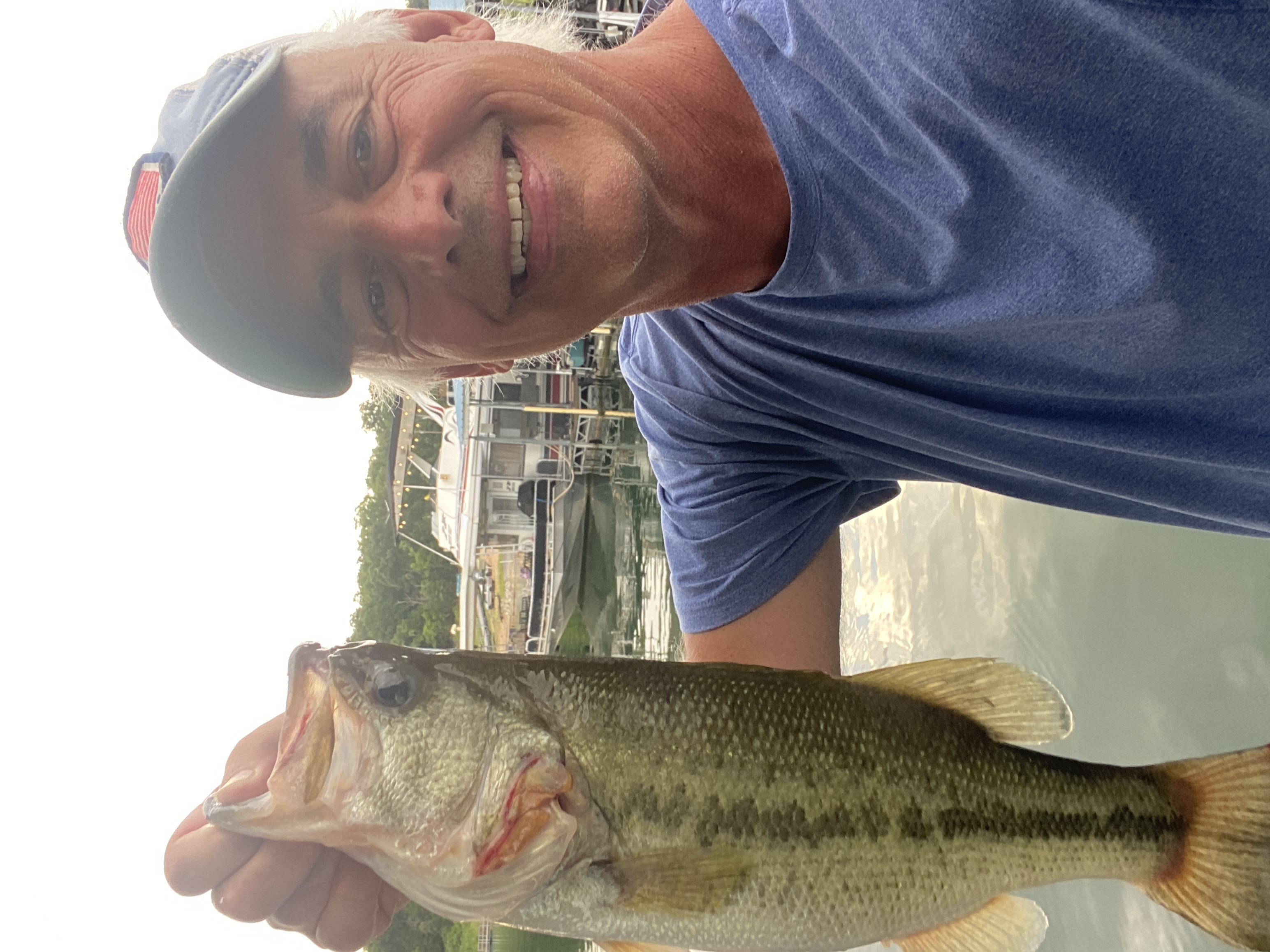 Captain Bill with a 4-pound Bull Shoals largemouth at the Create.Buzz dock.